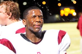 Del Sol's Keith Hill cools down on the sideline during the game against Canyon Springs Thursday. Del Sol won 31-16.